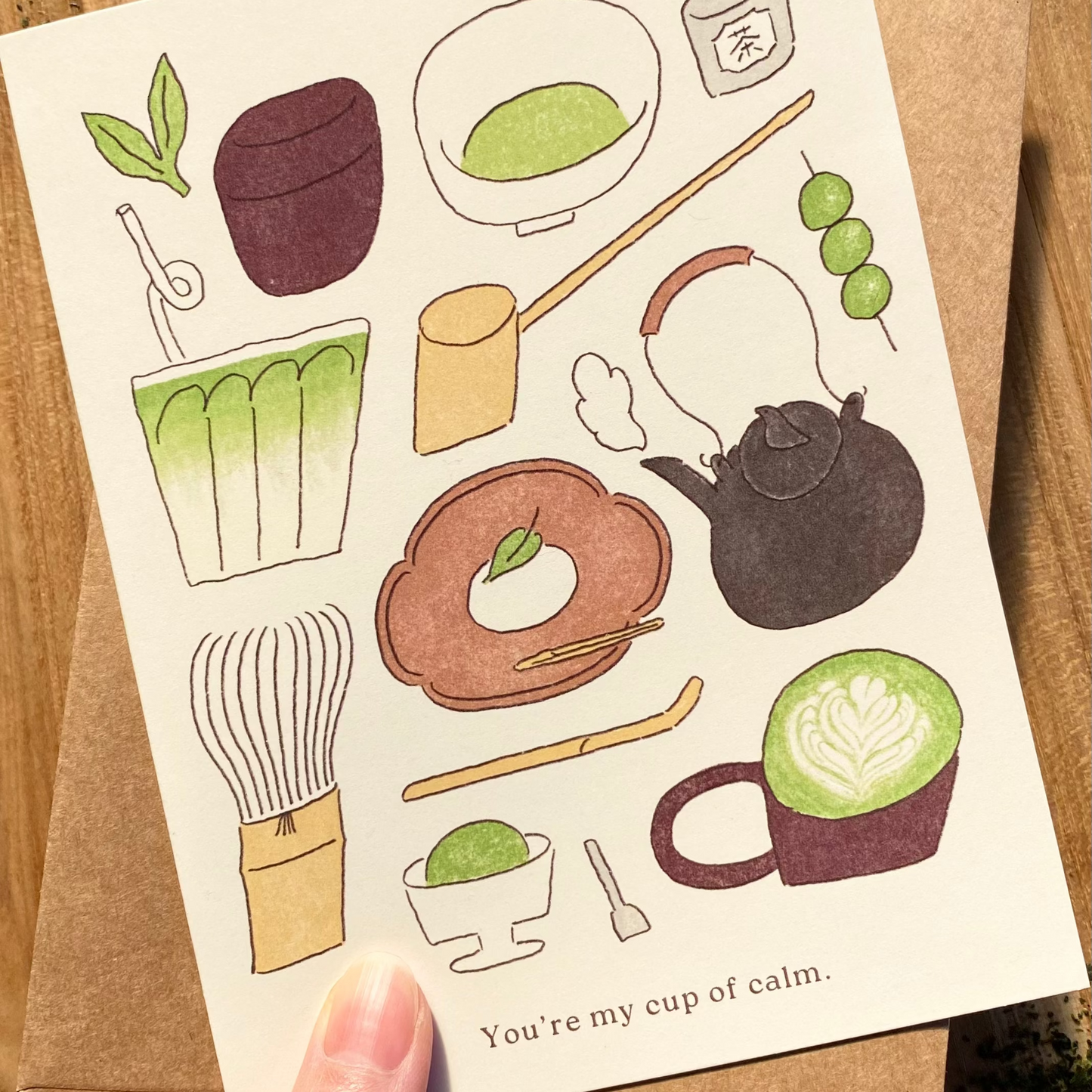 Card with illustrations of tea-making items and a text that says "You're my cup of calm"