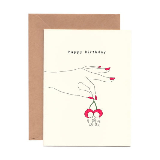 Cute Birthday Card with a hand with red nails holding two cherries 