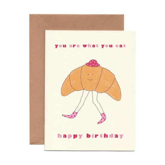 Cute and Funny Birthday Card that says “You Are What You Eat” with the illustration of a croissant with legs 