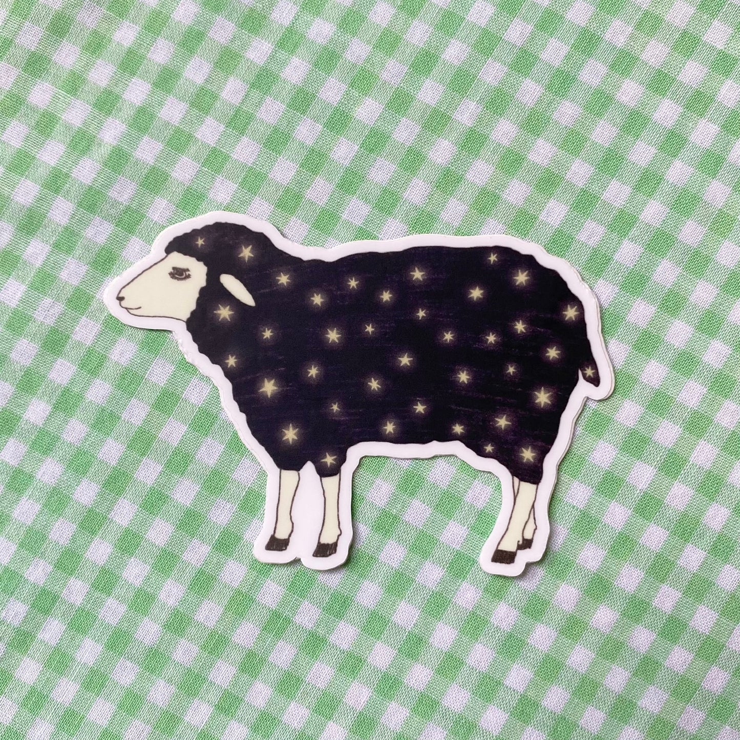 a vynyl sticker with the illustration of starry sheep