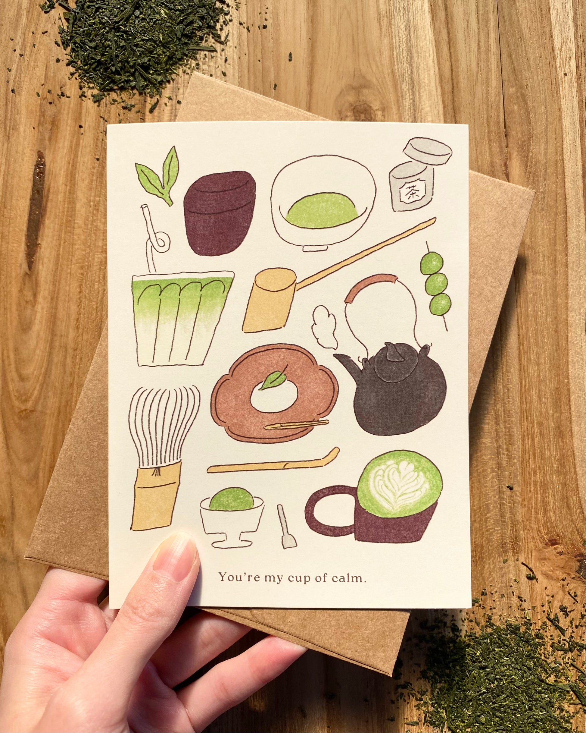 Greeting card with tea-themed illustrations 