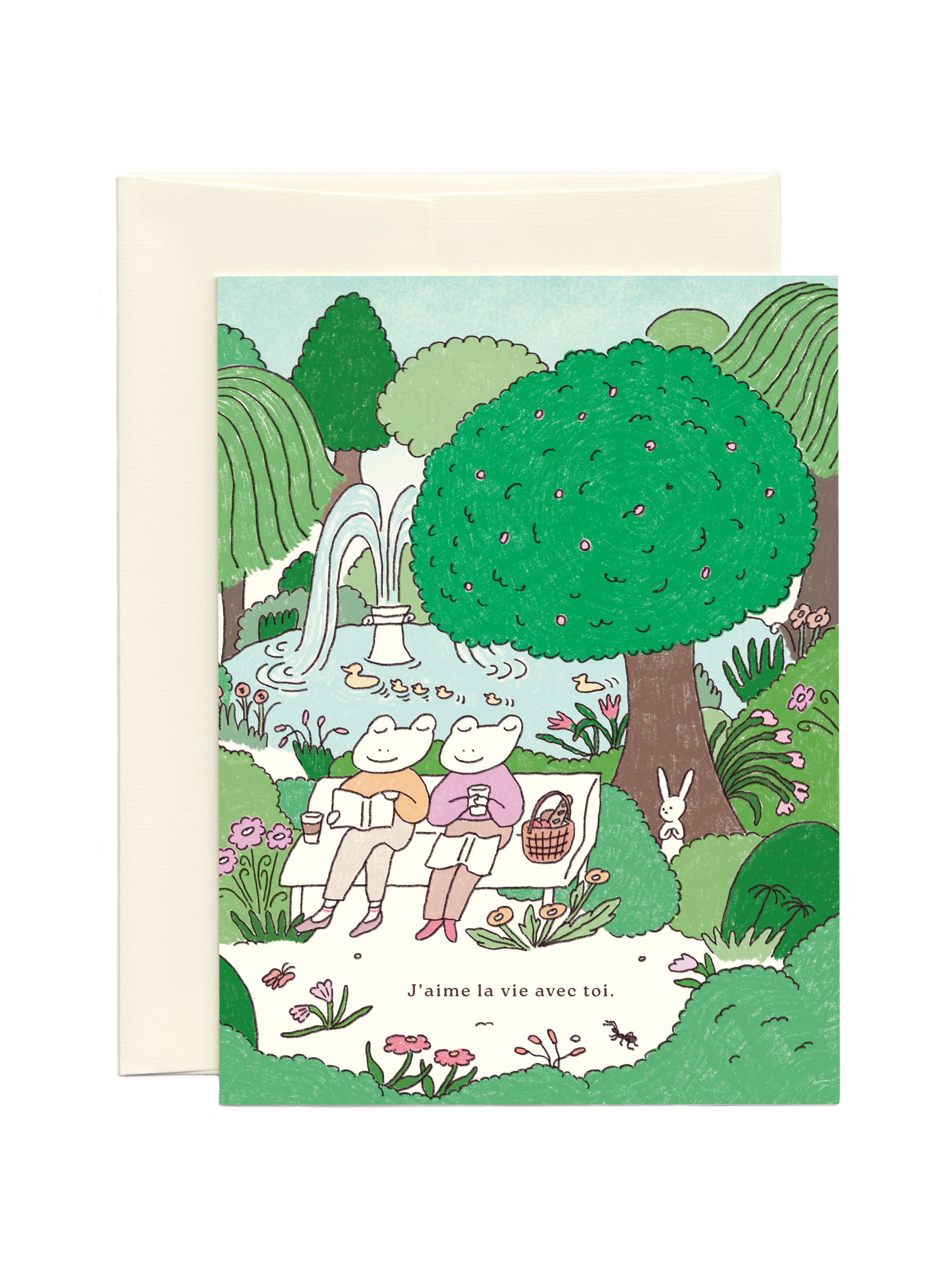 Love you card with illustration of two frogs reading together on a park bench surrounded by nature.