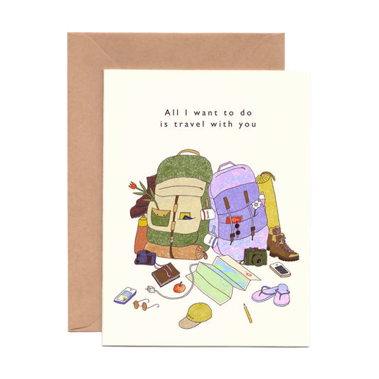 Greeting card with travel-themed illustration and 'All I want to do is travel with you' text