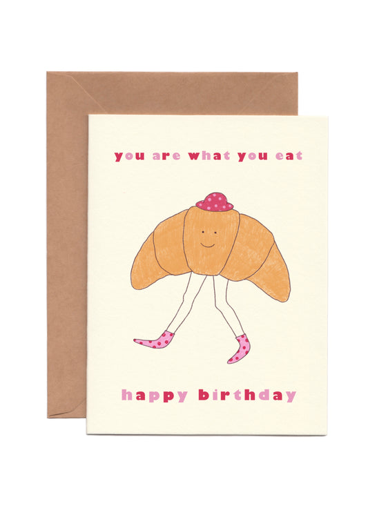 Cute and Funny Birthday Card that says “You Are What You Eat” with the illustration of a croissant with legs 