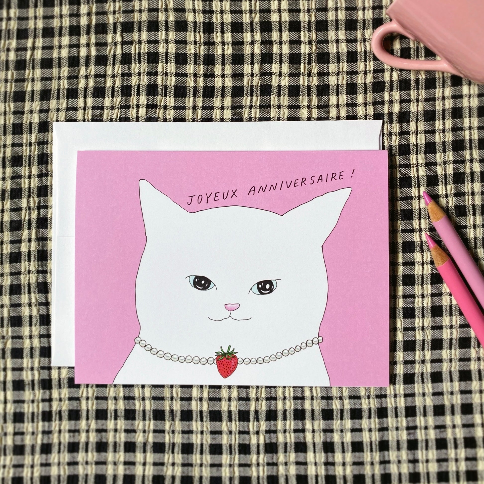 Cute Pink Birthday Card that says “Joyeux Anniversaire!” with a sassy cat wearing a pearl necklace