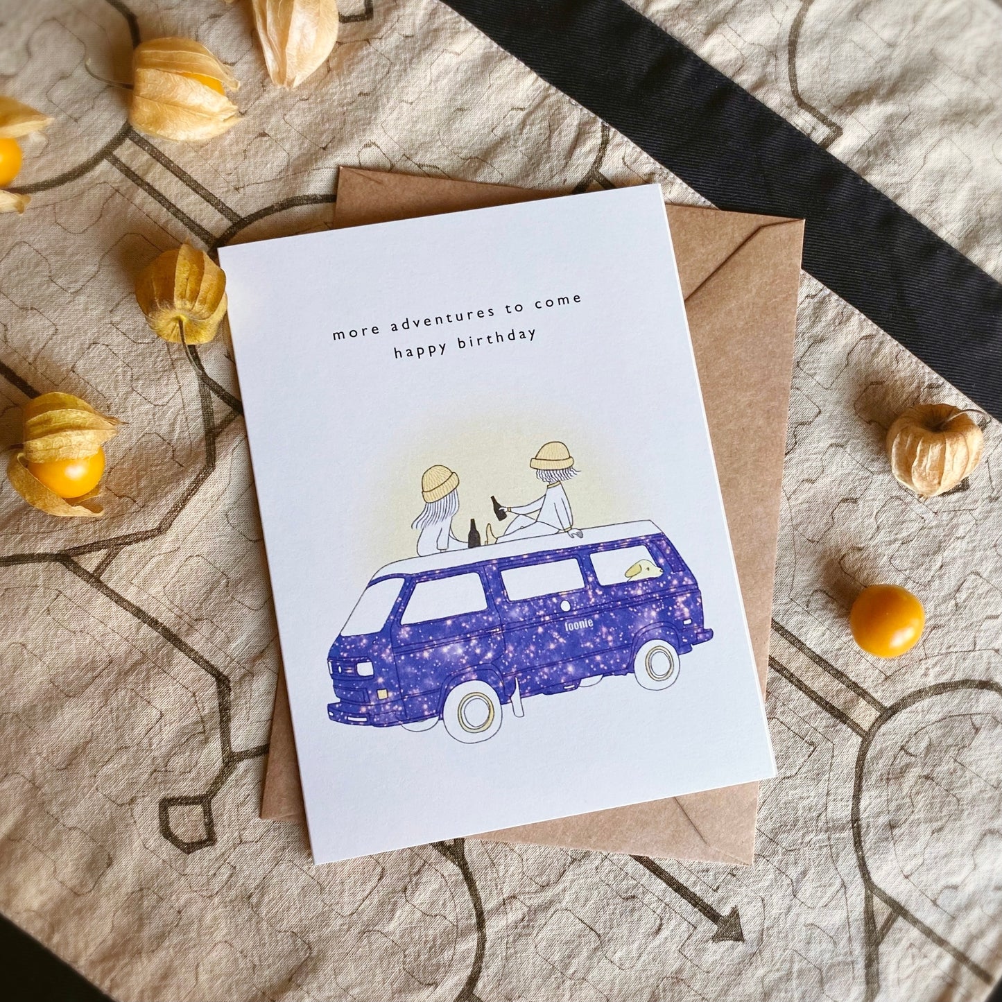 Outdoorsy Birthday Card set with the illustration of two people wearing toques on a vintage camper van