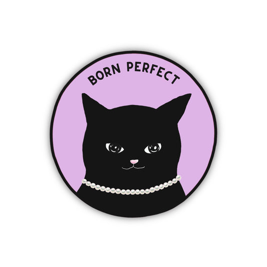 A motivational round sticker with a cute and wise black cat wearing a pearl necklace with the text “born perfect”