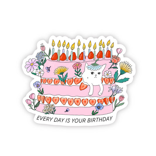 Cute waterproof sticker of a white cat sandwiched by a pink birthday cake with lots of strawberries and flowers
