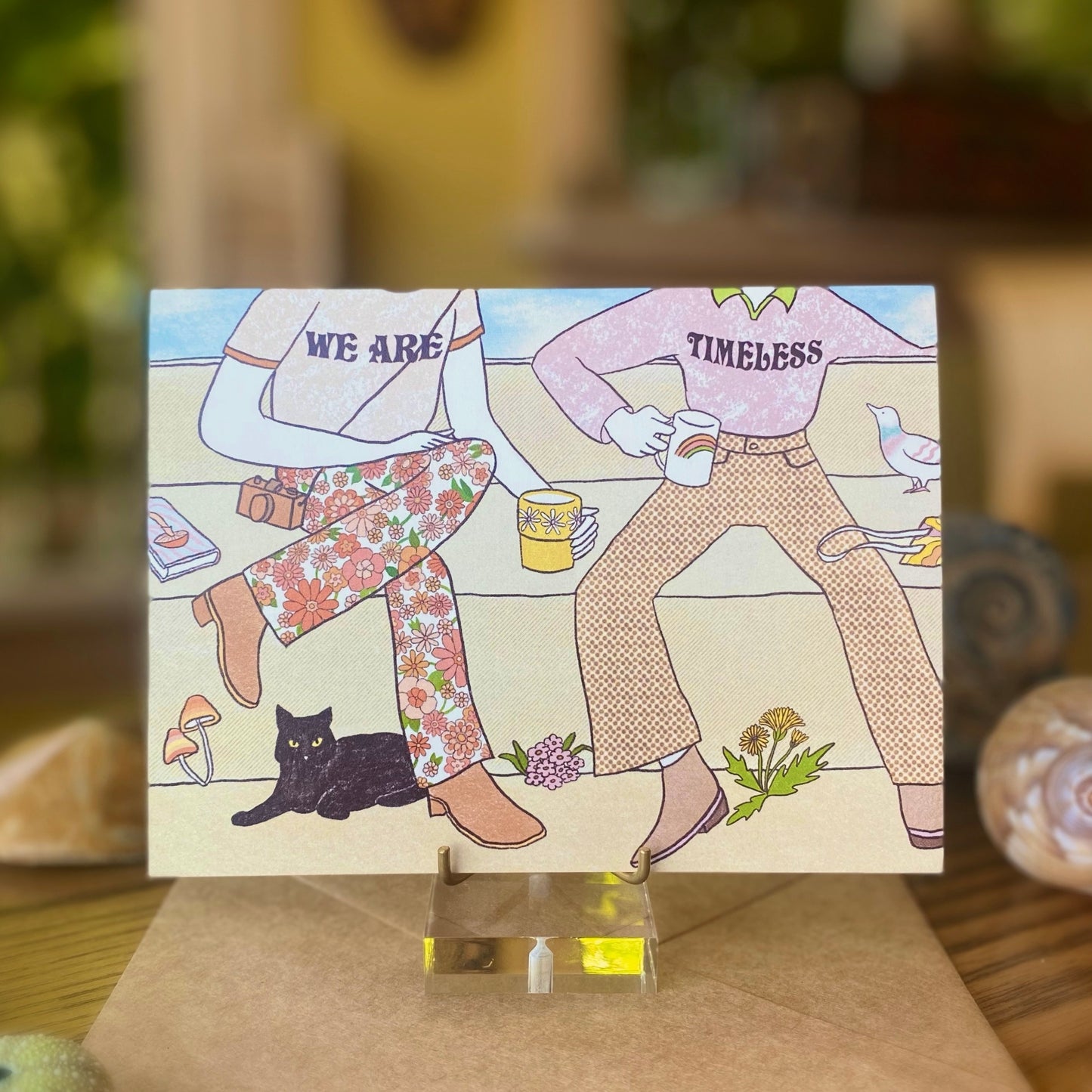 vintage themed just because card that says ”We are Timeless” with the illustration of two people dressed in 70s fashion
